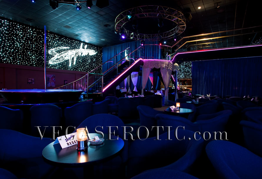 Sapphire is the largest strip club in Las Vegas, and the world. Blue interior accents, neon stage, blue sapphire sign