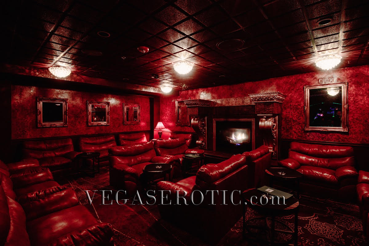 VIP Lounge at Sohpia's Gentlemen's Club with leather couches, ornate wall textures, and erotic artworks